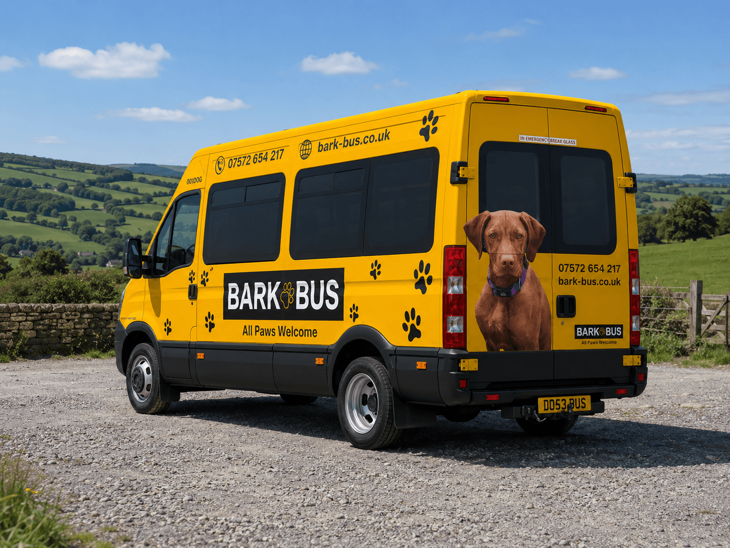 Bark Bus side profile showing the full wrap — wordmark, paw prints and the dog graphic
